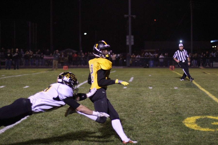 Lone Trees Jovonte Squiers (#2) escapes the grasp of a Midland defender during his 54 yard punt return touchdown in the second quarter. It was his fourth punt return touchdown of the season. 
