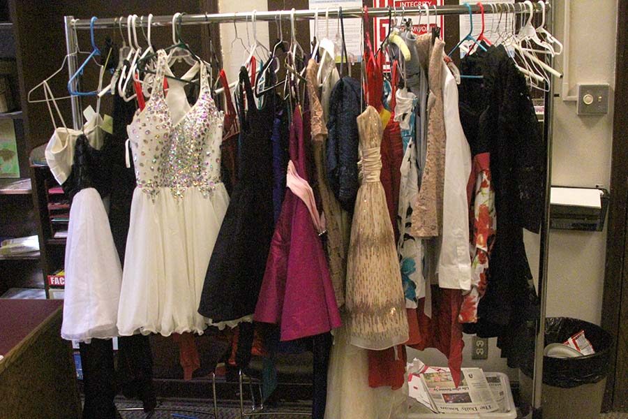 Dresses are being displayed in the welcome center.