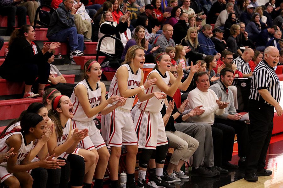 City Highs bench reacts during Citys game against Xavier. 