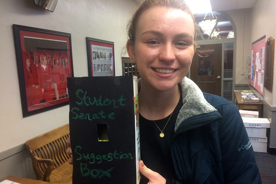 Student Senate President Lucia Wagner 17 with the suggestion box.