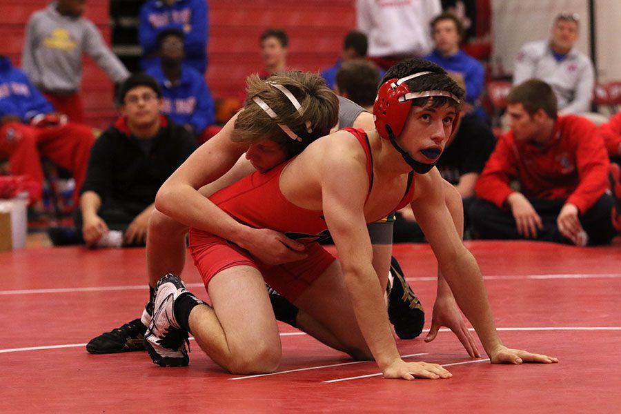 Michael Santoro 19  and his opponent prepare to wrestle in referees position 