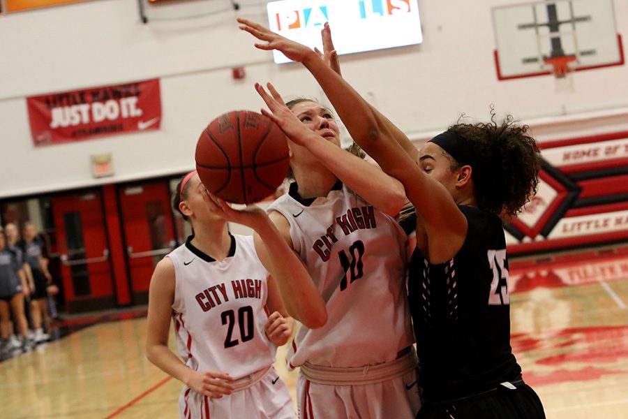 Ashley Joens 18 goes up for a shot while being guarded by Ankeny Centennials Keanna Williams 18. 