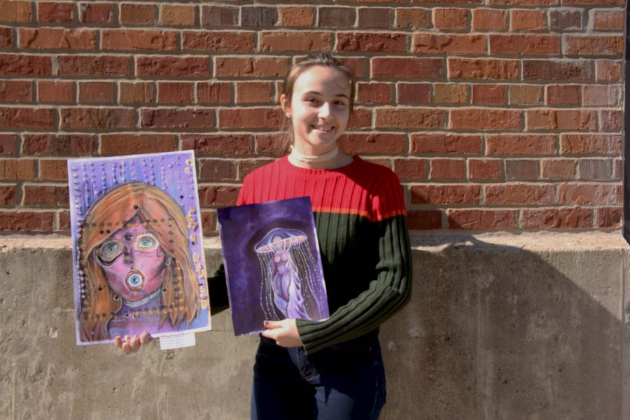 Esme Rummelhart '17 showcases two her her pieces featured in the art show