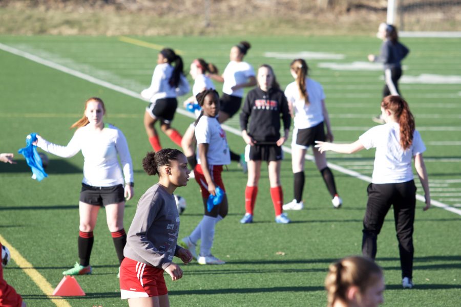 Julia Lusala 17 has her game face on as she completes a passing drill. 