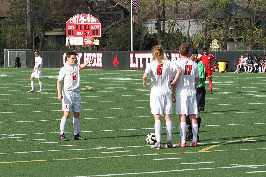 Jackson Meyer 18 lines up his team as he prepares to take a shot.