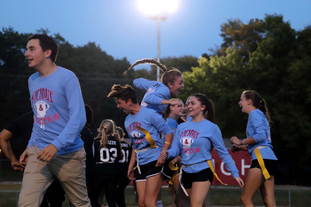 Teammates Madeline Pugh 19 and Naomi Meurice 19 celebrate a touchdown