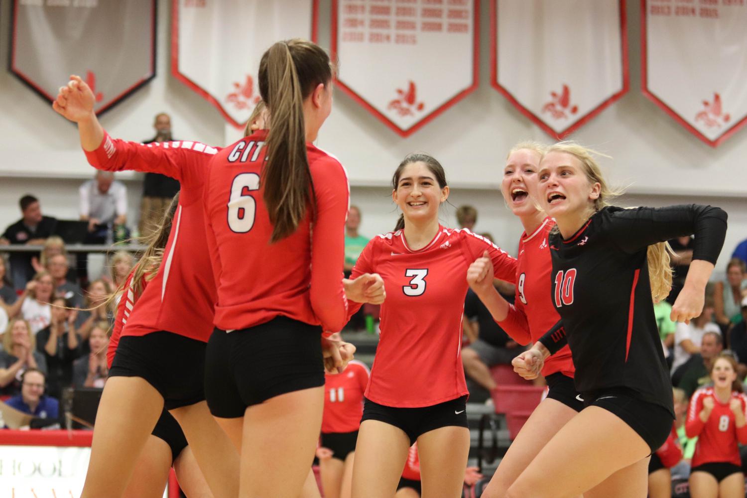 Teammates celebrate after receiving a point.