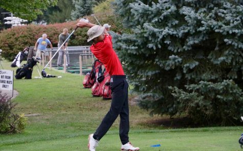 Winston Lui 18 takes a swing during the Little Hawks meet at the Pleasant Valley golf course.