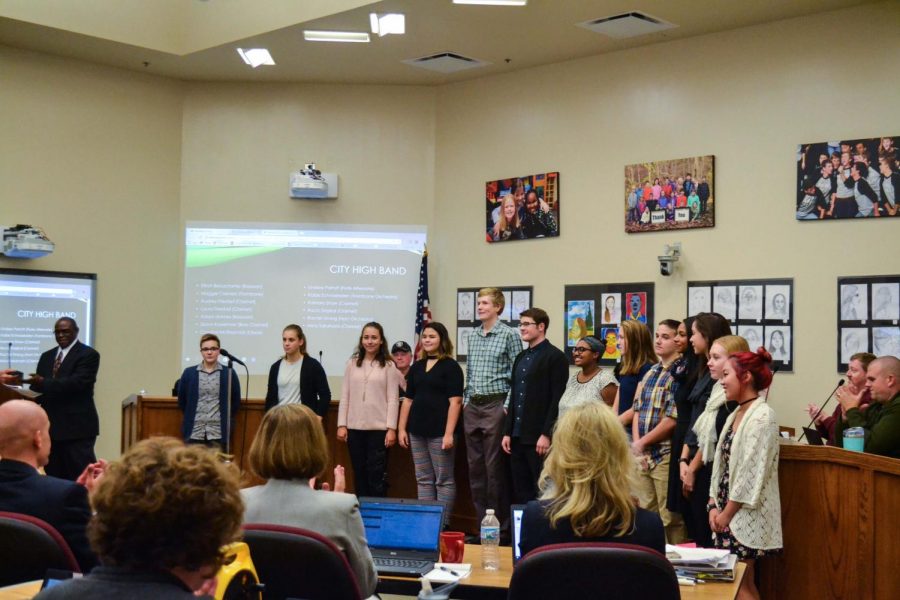 City High band members who were accepted into All-State are recognized in front of the Iowa City Community School Board.