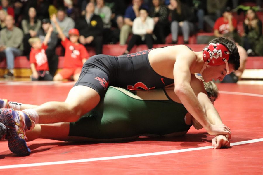 Matt Rew 20 pins his opponent in one minute during the Little Hawks meet against West High on December 14th.