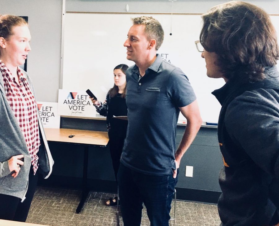 Jason Kander, founder of Let America Vote, talks to UI students following the event on August 24.