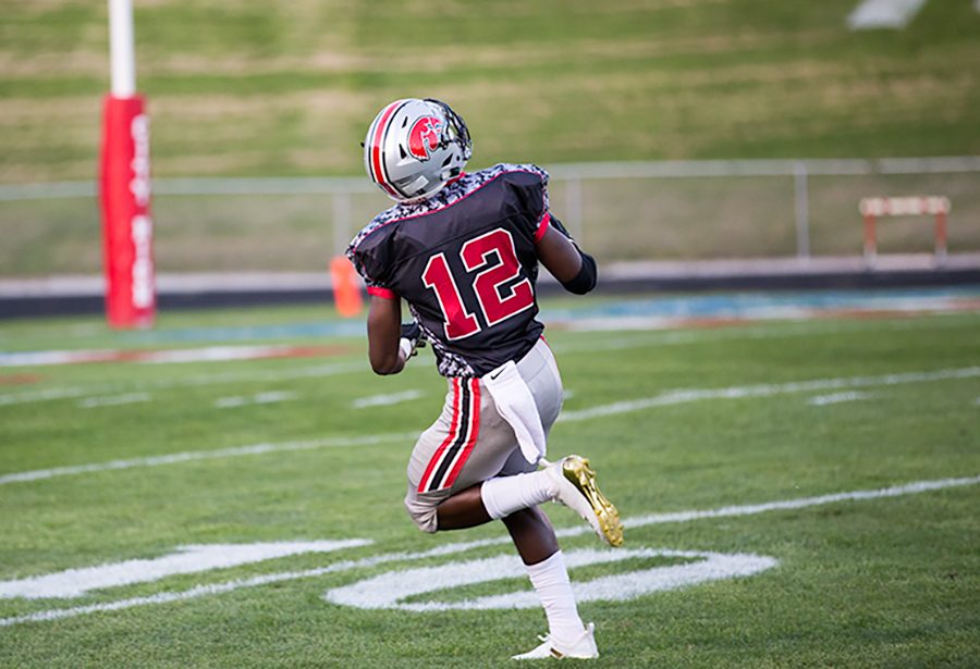 Malik Kimber 19 warms up for the big game.