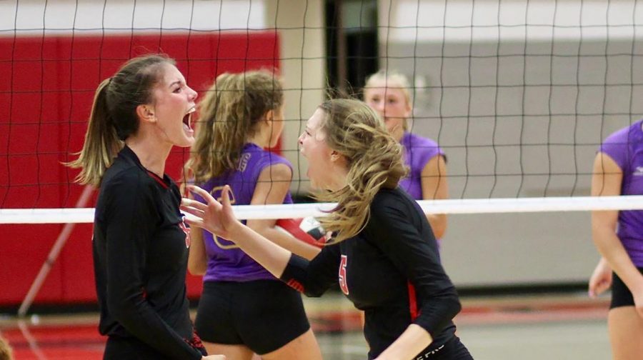 Eli Evans 19 erupts after a kill during the City vs. Muscatine first round playoff game.