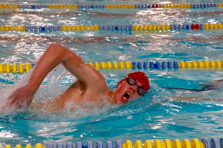 Soren Ostby 21 competes in the 200 medley relay.