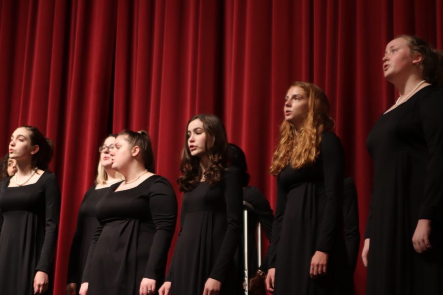 A group of students sing for their performance in the competition.