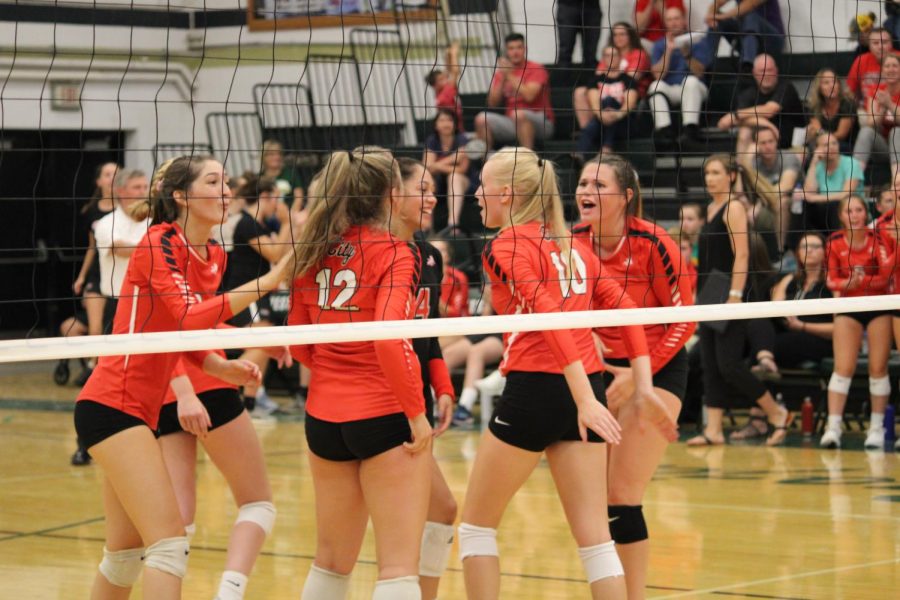 City High Volleyball celebrates after defeating West in the Battle for the Spike on August 27, 2019. 