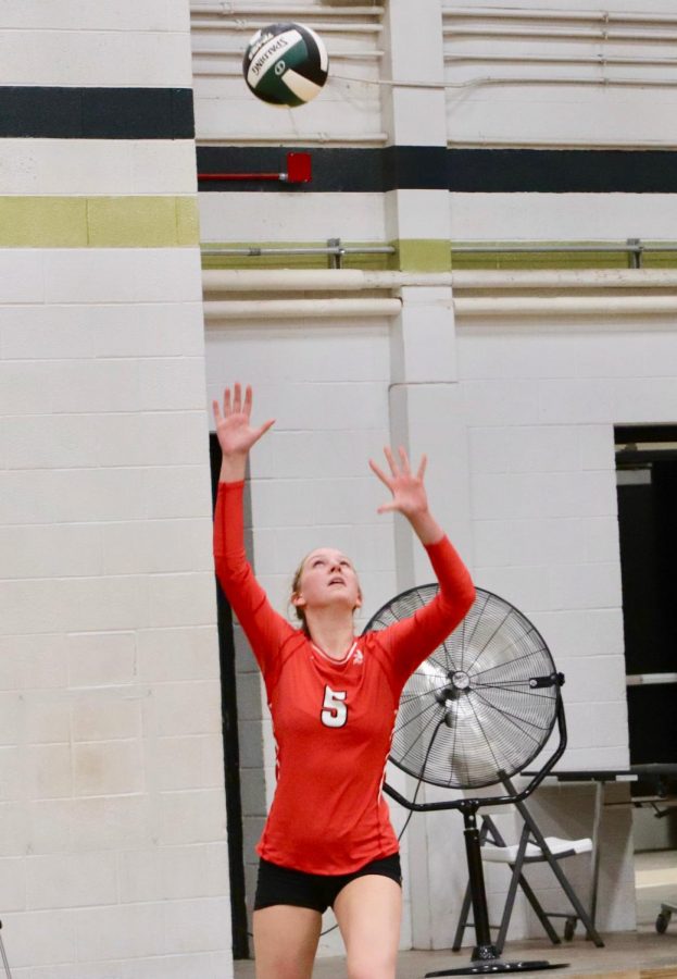 Brooke Herzic 21 serves the ball during The Battle for the Spike.