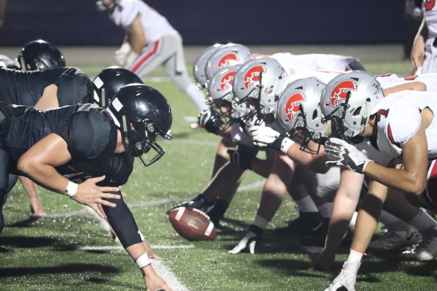 Liberty High vs. City High  in the first football game of the season.