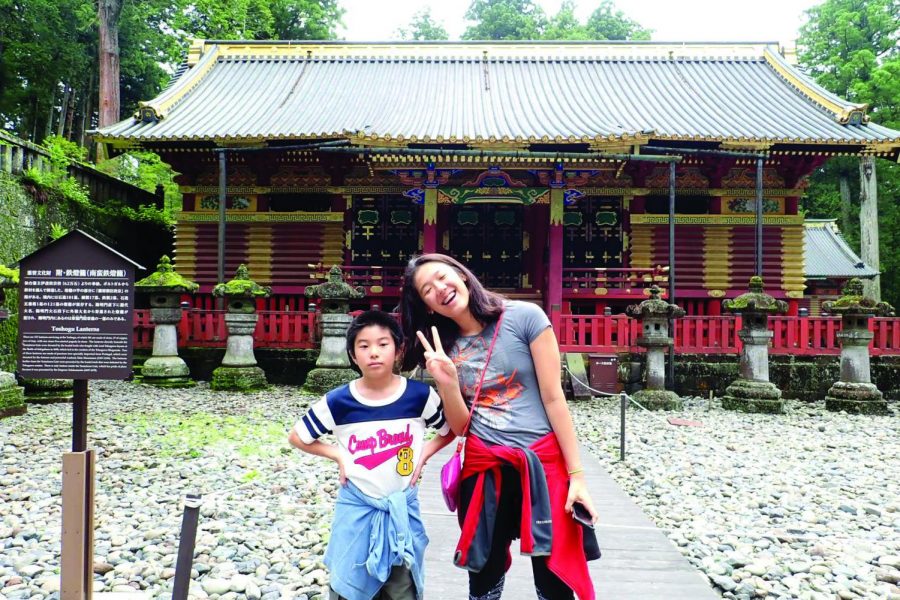 Rika Yahashiri 21 and her younger cousin pose for a photo in Hong Kong