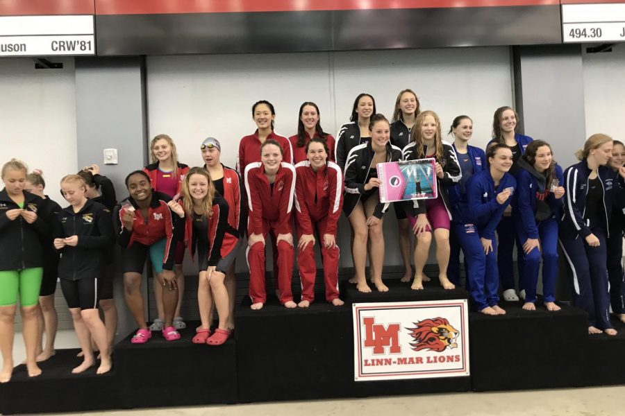 The 200 freestyle relay team of Rika Yahashiri 21, Averi Loria 22, Carly Weigel 20 and Olivia Masterson 20 (Amelia Lang-Fallon 23 accepts Mastersons award while Masterson gets ready for her next race) placed 2nd and qualified for state