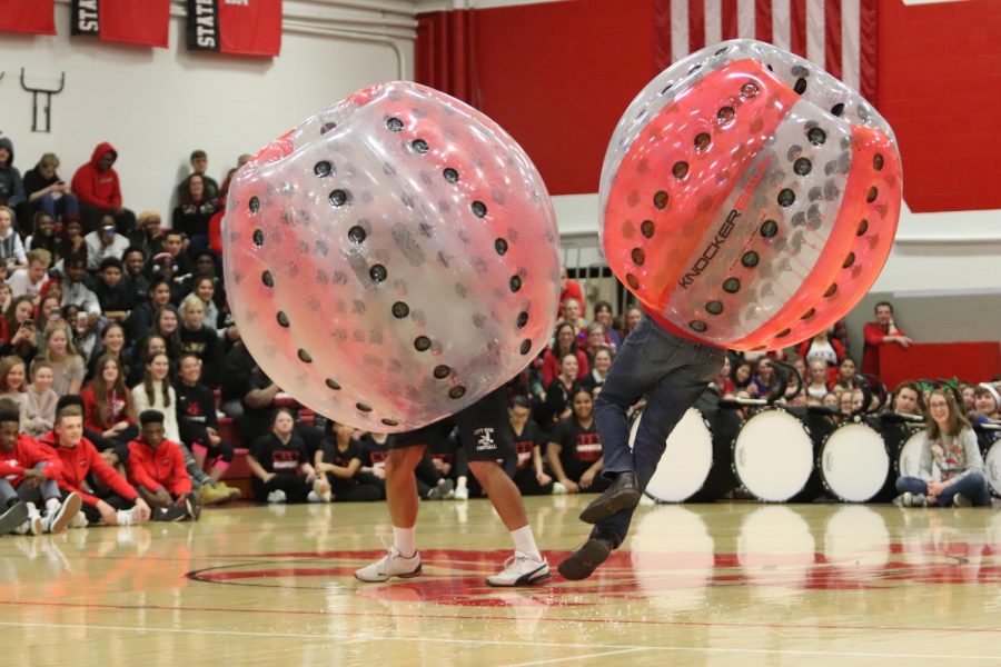 Teacher fight in hamster balls during the winter pep assembly. 