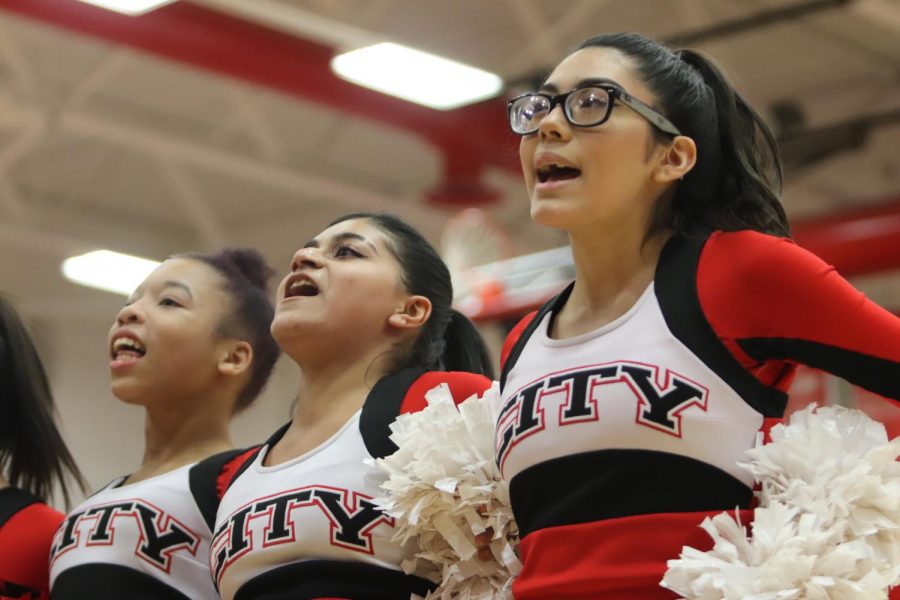 City+High++cheerleaders+cheering+during+a+girls+basketball+game.+