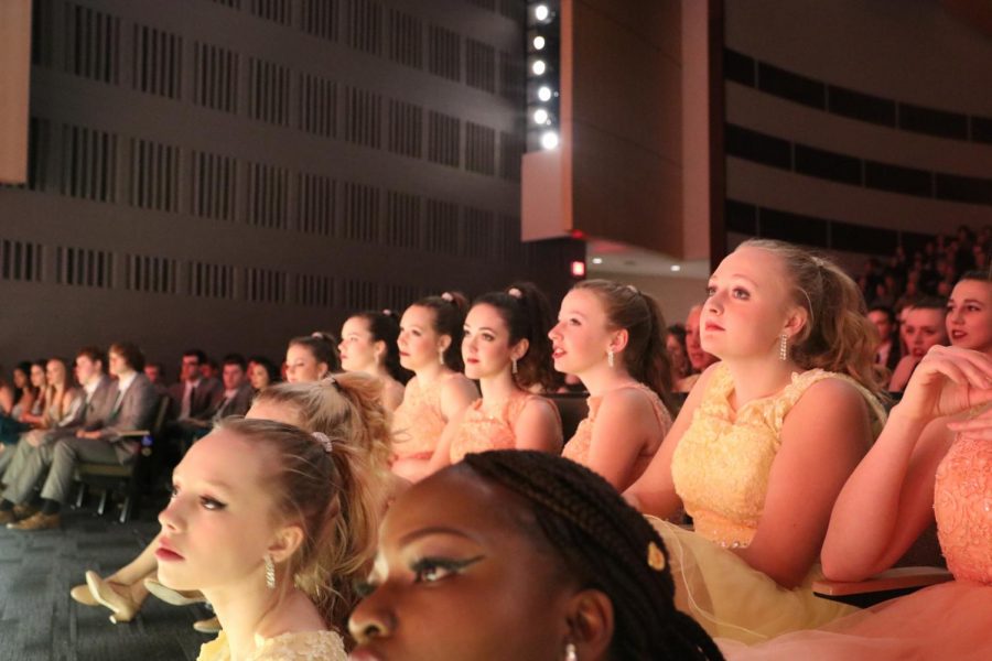 Charisma and other schools show choirs watch Fourth Avenues performance.