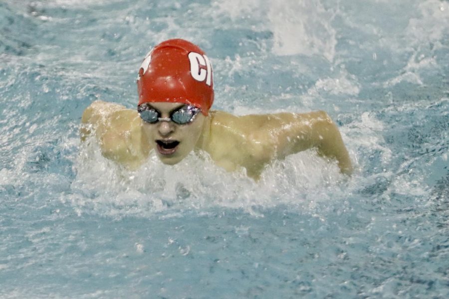 John Weigel 23 swims the 100 butterfly at Linn-Mar, finishing with a season best time of 1:02.03.