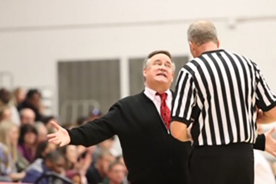 Coach McTaggart animatedly talking to a referee during the game against 