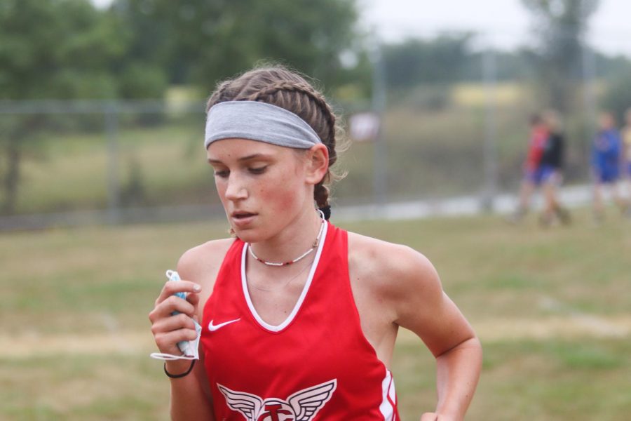 Erin Anderson 23 in the girls varsity race in her second mile.