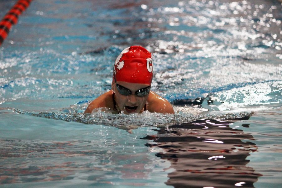 Isabelle Polfliet 23 swims the 100 breaststroke in a dual meet against Waterloo
