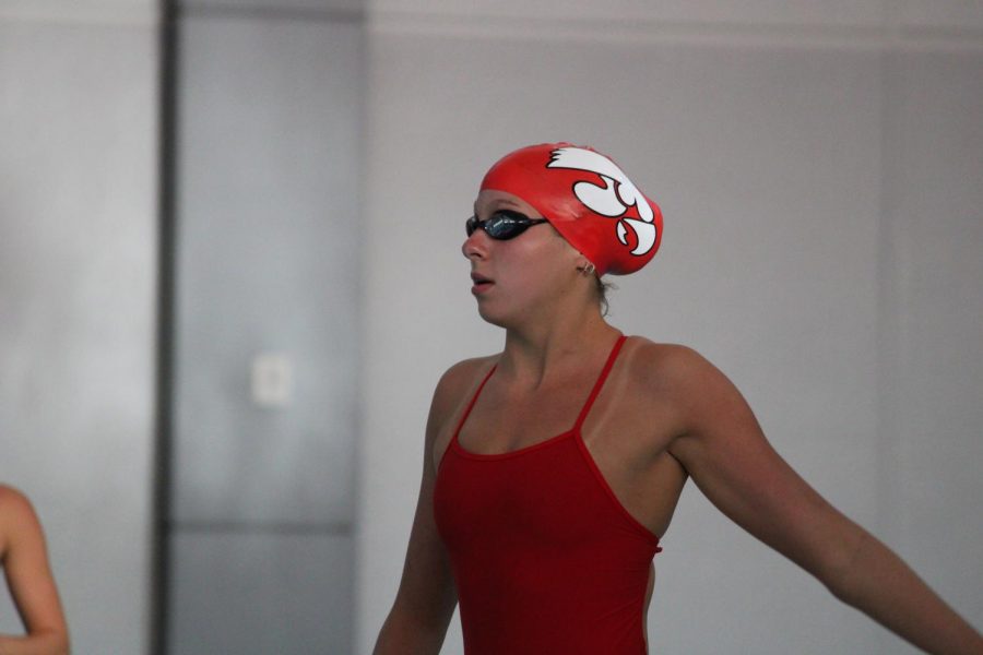 Heidi Stalkfleet 22 prepares for her 500 yard freestyle at the first dual meet of the 2020 City High girls swim season.