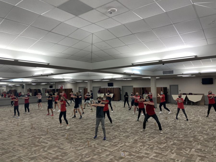 Fourth Ave show choir practicing in the City High cafeteria before the decision to go online. 