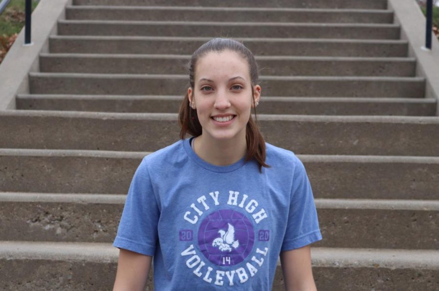Claire Ernst 24 poses for a picture on the front steps of City High. She is a starter on the City High varsity volleyball team.