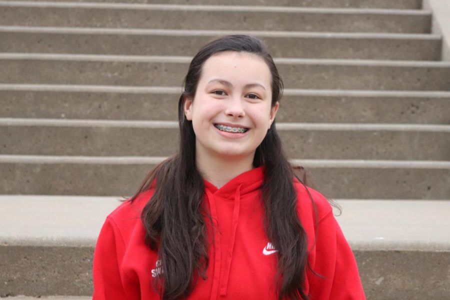 Kalea Seaton 24 poses for a picture on the front steps of City High. She was on the City High girls swim state team this past fall.