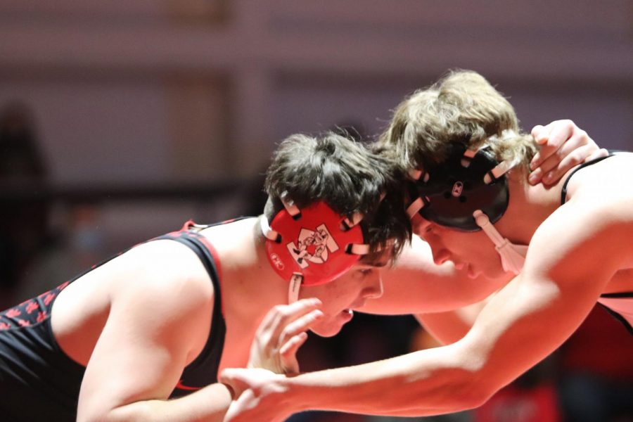 Nick Marker 23 grapples with his Liberty High opponent. 
