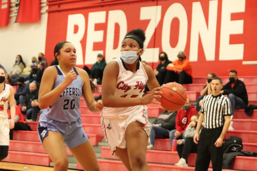 Kacie Earl 22 avoids a defender before jumping to score a layup in the fourth quarter. 