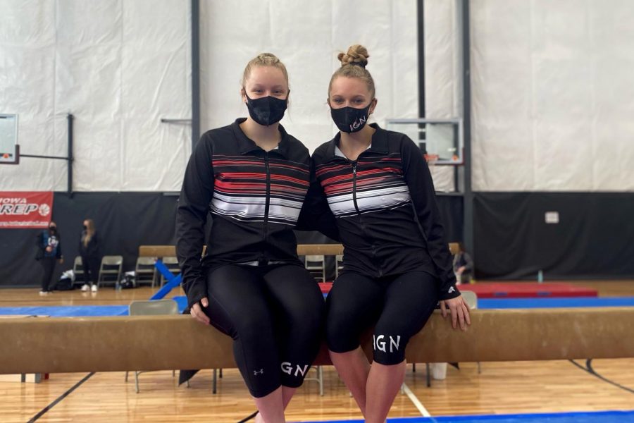 Natalie Green ‘21 and Jordan Sekafetz ‘21 posing on a beam during their senior year of gymnastics.