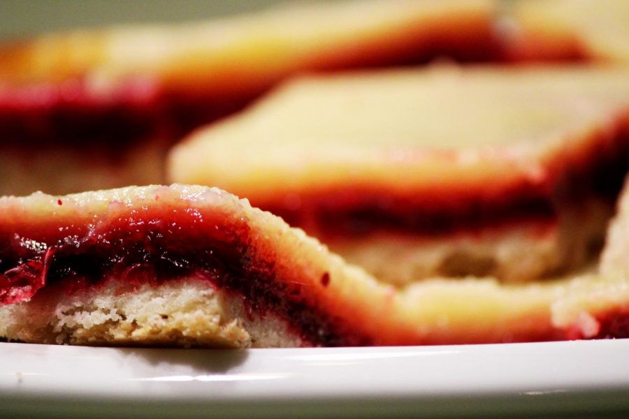 Cranberry lemon layered bars, a smooth sheet of tart lemon sits on top of a layer of sweet cranberries with a bed of crumbly crust. These treats melt in the mouth and stay fresh for days. 