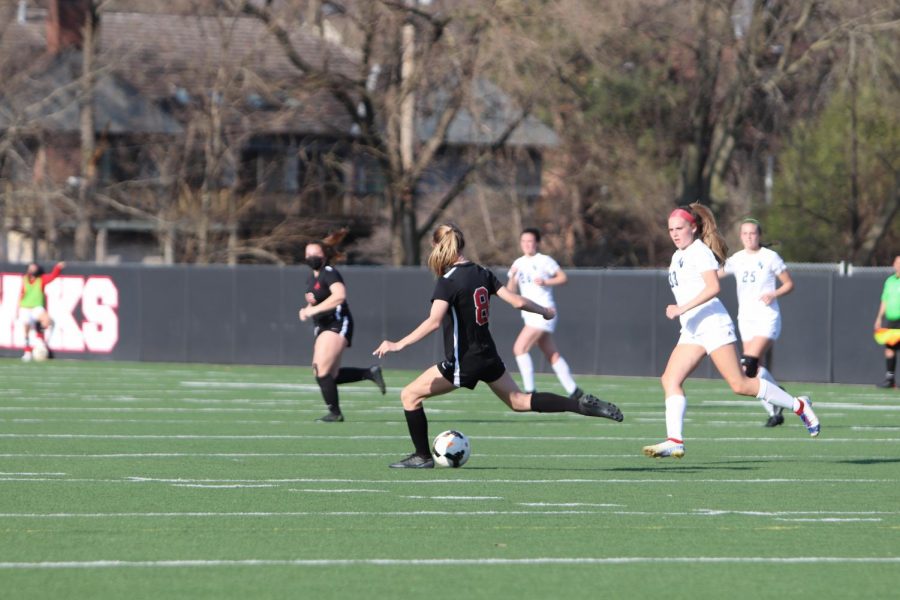 Girls varsity player #8 Aoife Boulter kicks the ball in their game against PV.