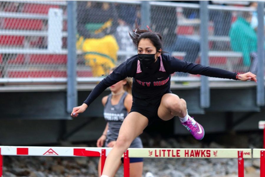 Maya Morales 21 running the second leg of The Shuttle Hurdle relay. 