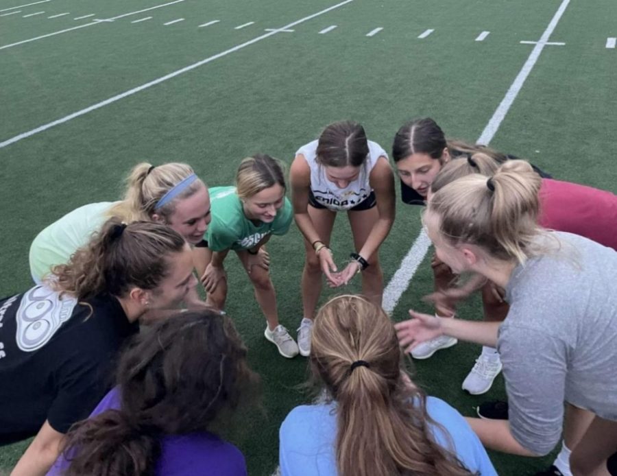 Smack that Pass team huddles during practice.