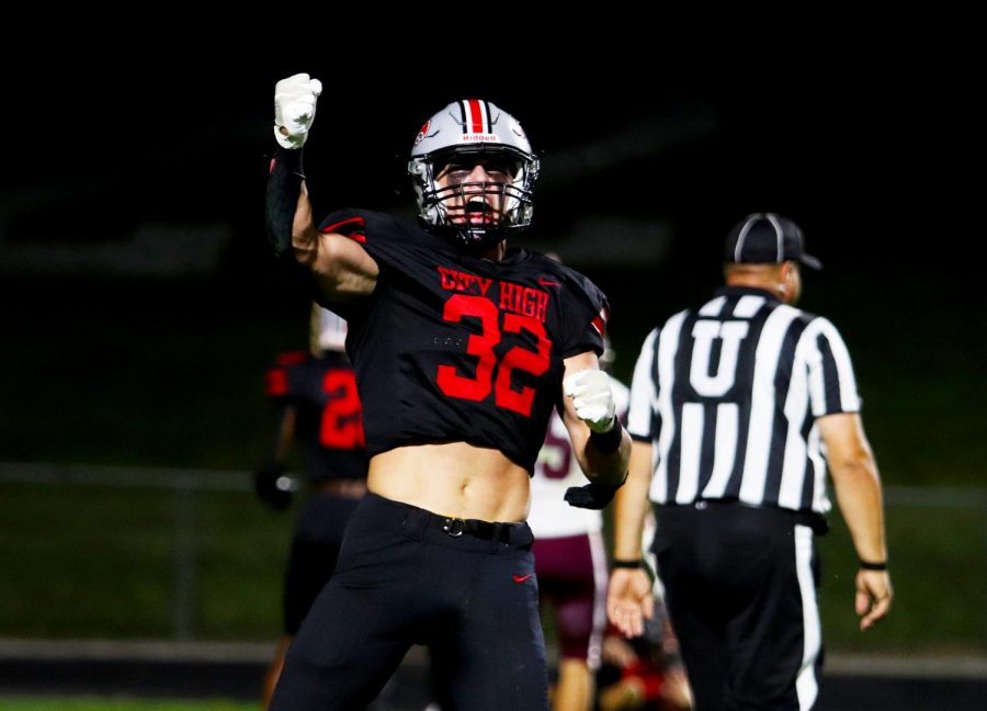 Ben Kueter 23 celebrates after the City High touchdown