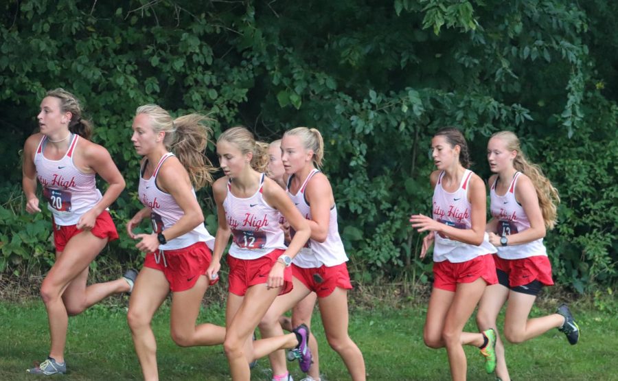City High Girls Varsity strides together on their first race of the season.
