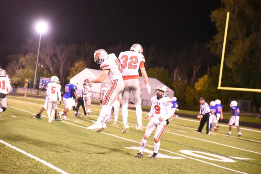 City High celebrates a big play in a win over Davenport Central