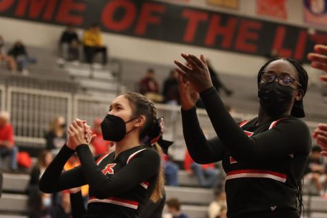Anna Gayley 22 and Aminatha Rukakiza 25 lead the stundent section in a cheer