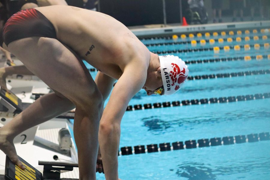 Will Larson 22 prepares to dive into the water at the MVC Varsity Supermeet.