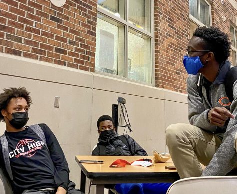 Deon Brown 24, Jameer James 24, and teacher Shamari Scott discuss plans for The Multi-Ethnic Student Union in the old commons.