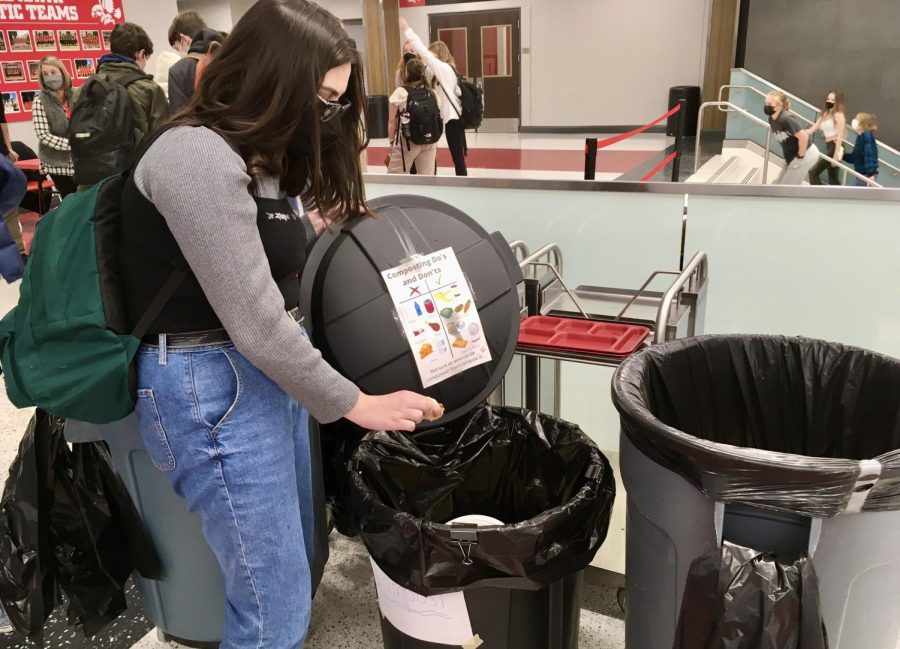 Nora Gibson '23 composts her lunch.  The newly added composting bins are meant to reduce City High's waste in traditional landfills.  