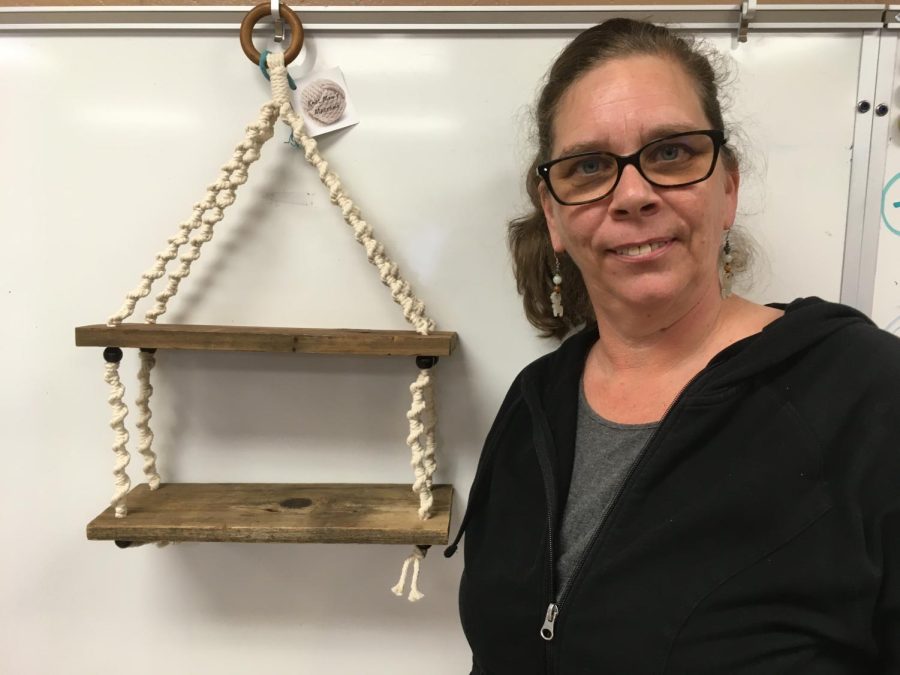 Mrs. Watson poses with a handmade macrame project.
